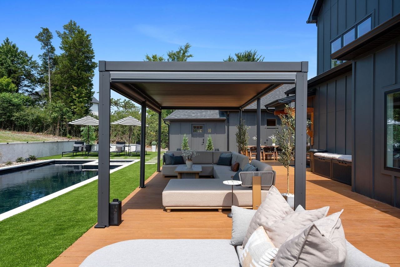 Under the pergola, looking along the deck toward the house.